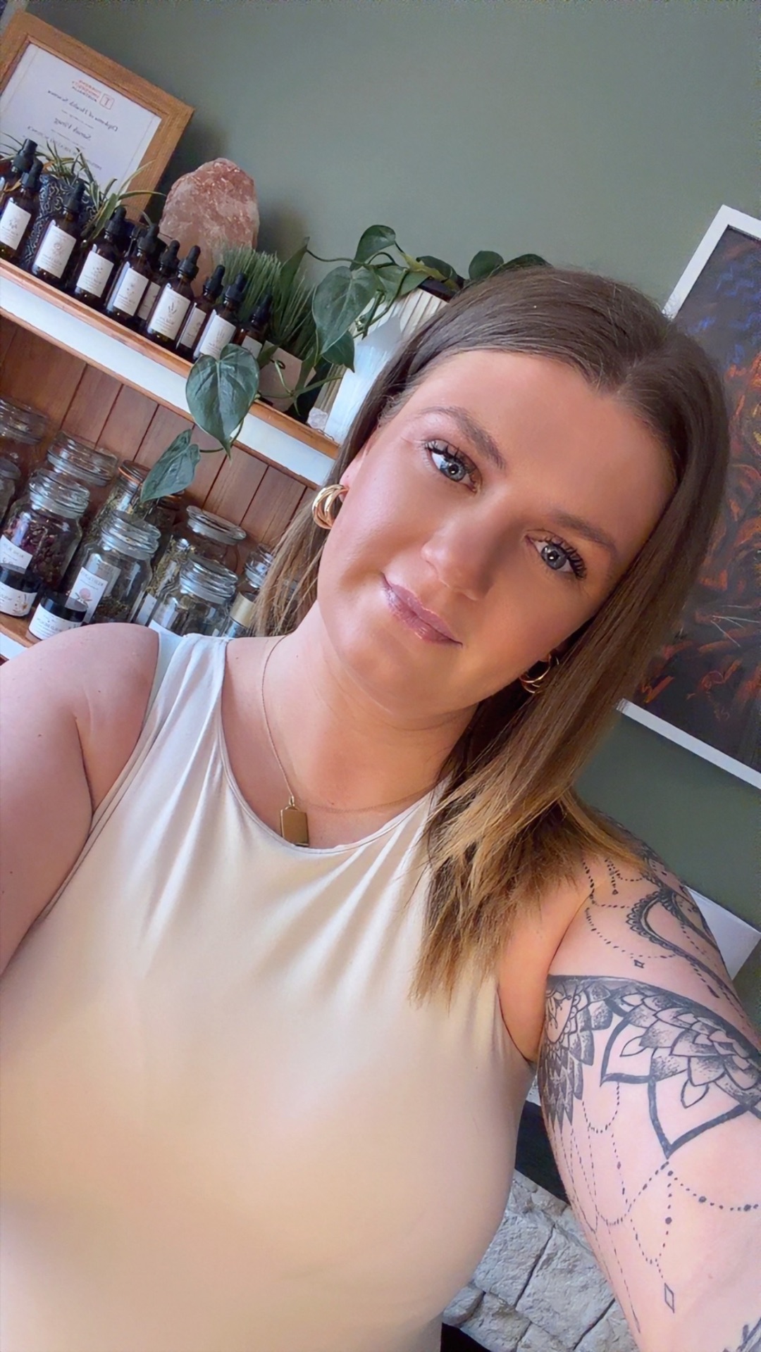 Sarah, naturopath and herbalist, in her Beaconsfield clinic in front of the herbal dispensary