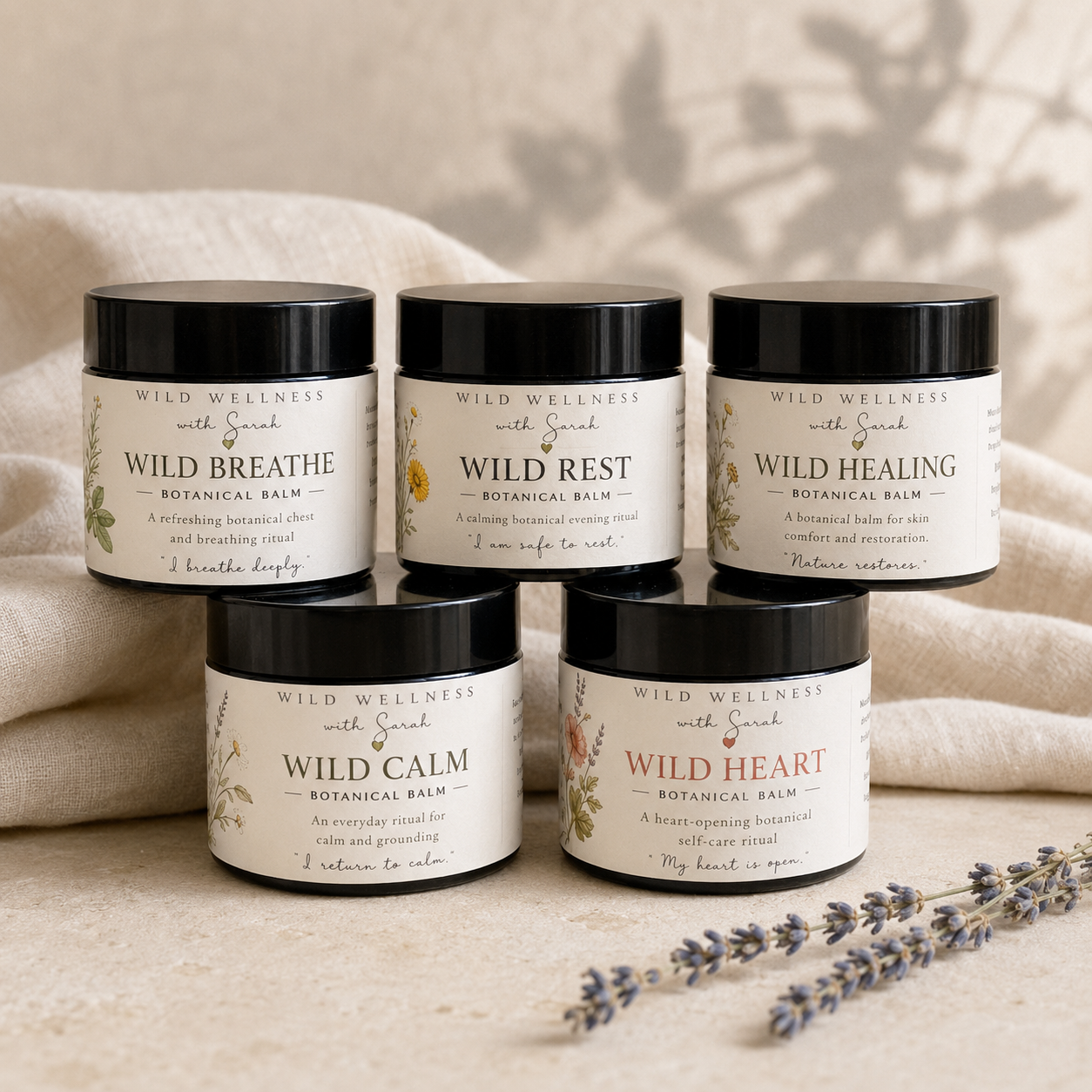 The Wild Wellness botanical balm collection in amber glass jars